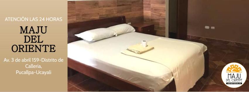 a bedroom with a bed with a tray on it at Hospedaje Maju Del Oriente in Pucallpa