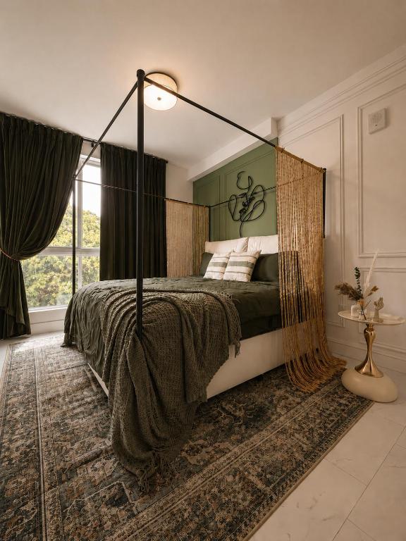 a bedroom with a bed with a canopy at Oasis on Monroe Aparthotel in Hollywood