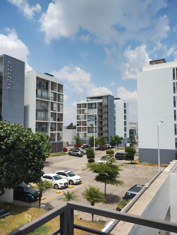 a view of a parking lot with buildings at Catalán Sant Andreu in Guadalajara