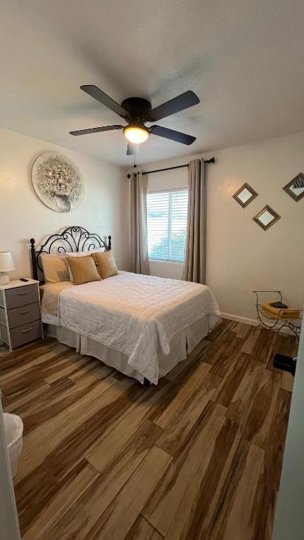 a bedroom with a bed and a ceiling fan at West Mitchell in Phoenix