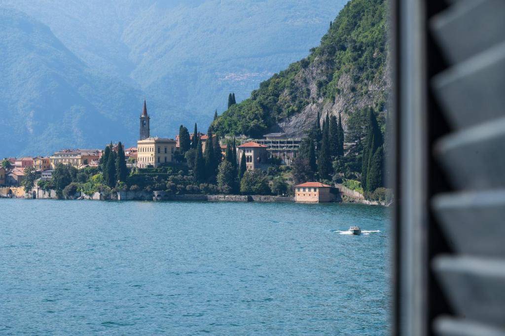 a view of a body of water with a town on a mountain at Sognando Varenna-Lake Como View- in Fiumelatte