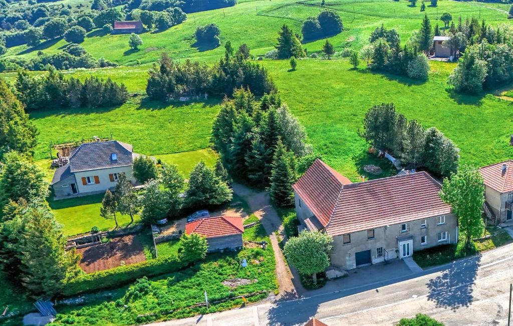 an aerial view of a house in a green field at Elegant Apprt in Lachamp-Raphaël