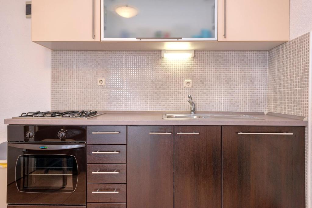 Kuchyň nebo kuchyňský kout v ubytování Apartments Zora