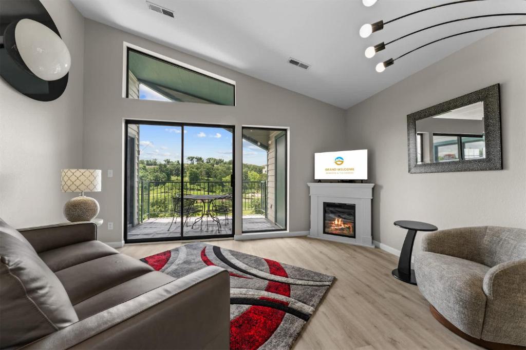 a living room with a couch and a fireplace at Green Mountain Getaway 2BDR in Branson