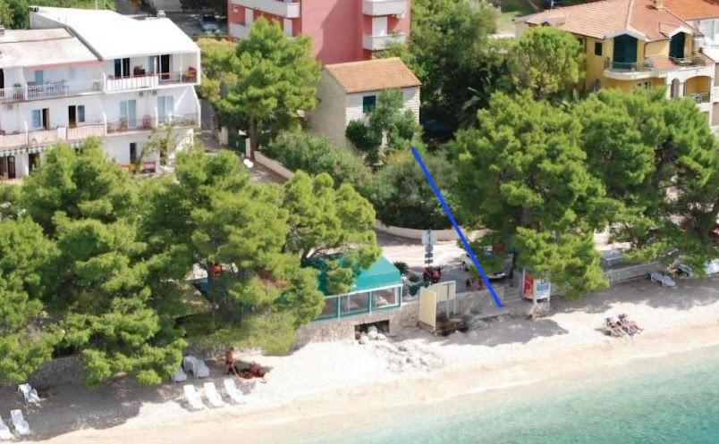 an aerial view of a beach with a resort at Garden House Tučepi in Tučepi