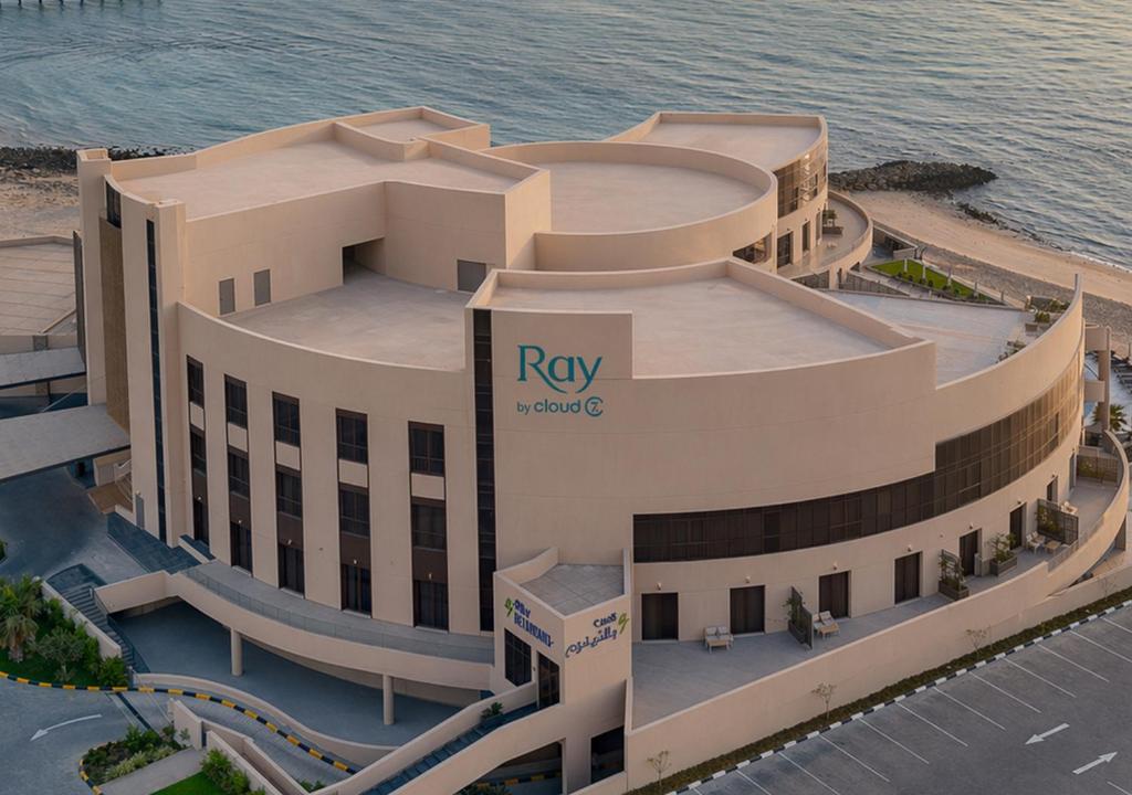 an aerial view of a building with the water at Ray Hotel by Cloud 7 in Kuwait