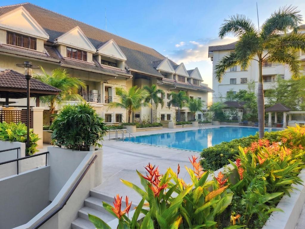 a view of the courtyard of a resort with a swimming pool at Domitys Bangsar Kuala Lumpur in Kuala Lumpur