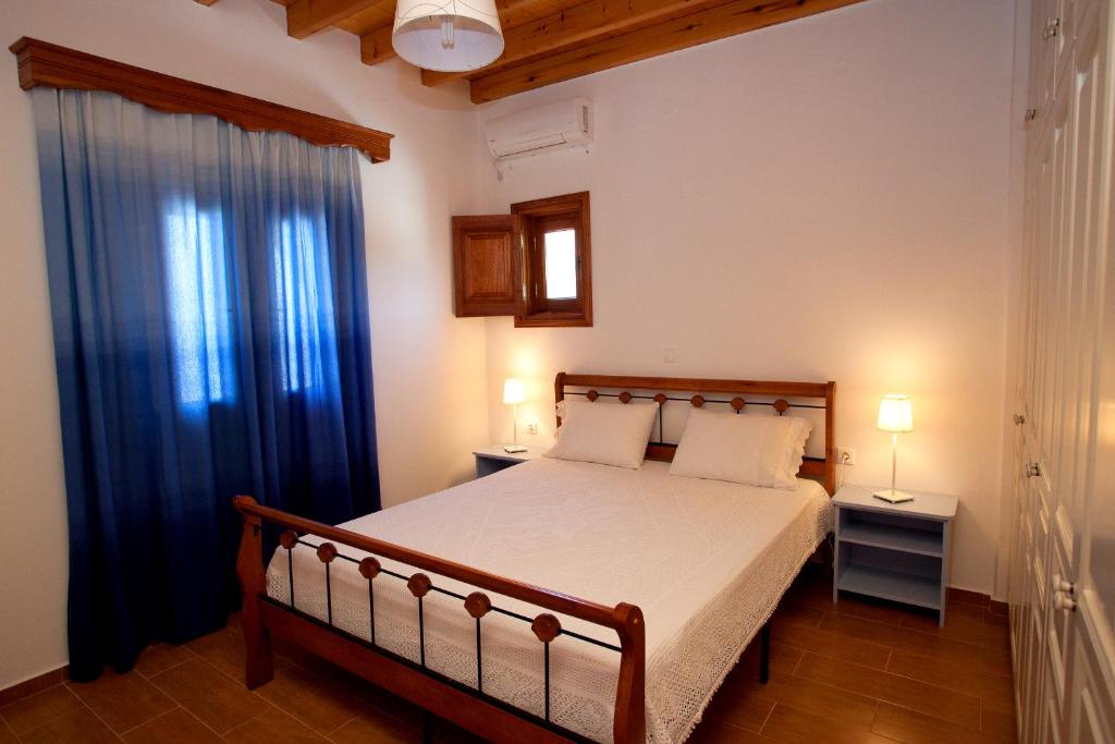 A bed or beds in a room at Thea House Patmos