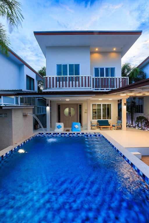 a house with a swimming pool in front of a house at Villa Paradise a unique cocoon in Bophut