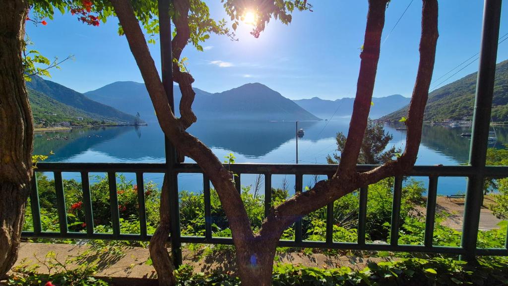 a view of a lake with mountains in the background at Apartment Capt Seferovic in Donji Morinj
