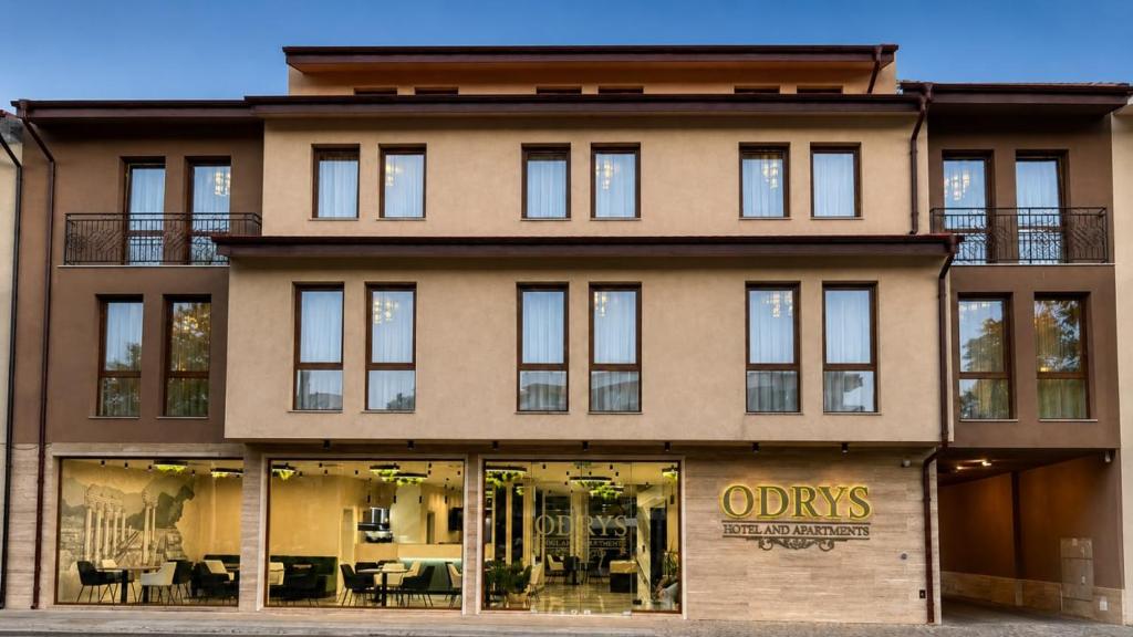 a store front of a building with windows at Hotel Odrys in Plovdiv