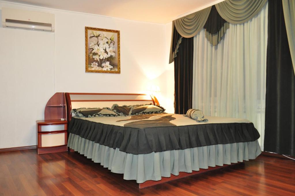 Кровать или кровати в номере Apartment Ex-Visit