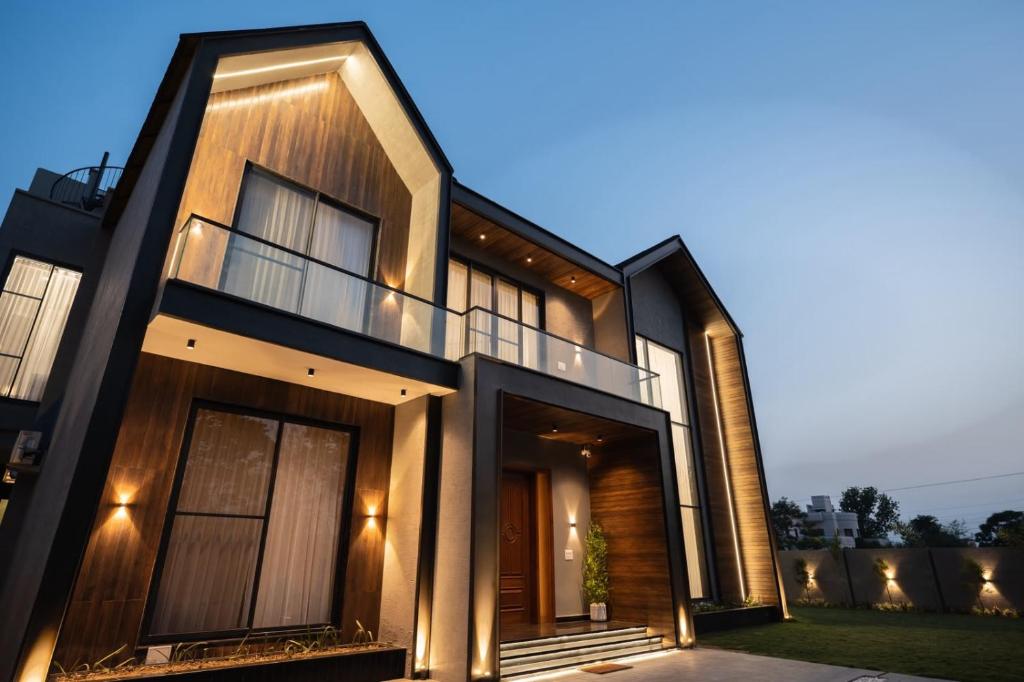 a modern house with a black facade at Sukoon Luxury Stay in Amritsar