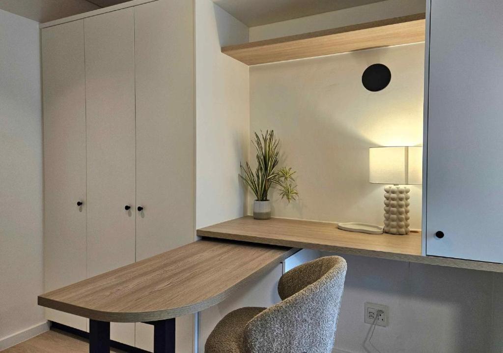 a dining room with a table and two chairs at High-Floor Modern Apartment - Rooftop Pool & Table Mountain Views in Cape Town