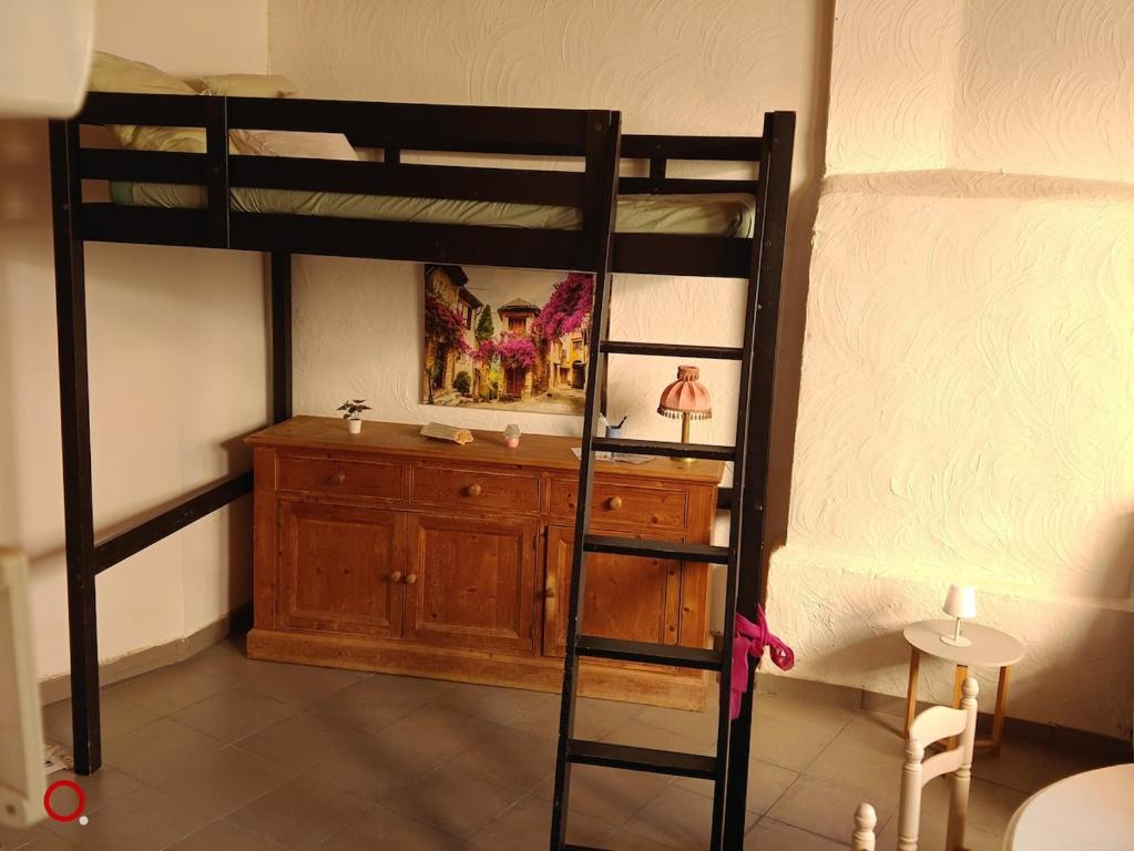 a bedroom with a bunk bed with a dresser at Studio centre ville d'orange in Orange