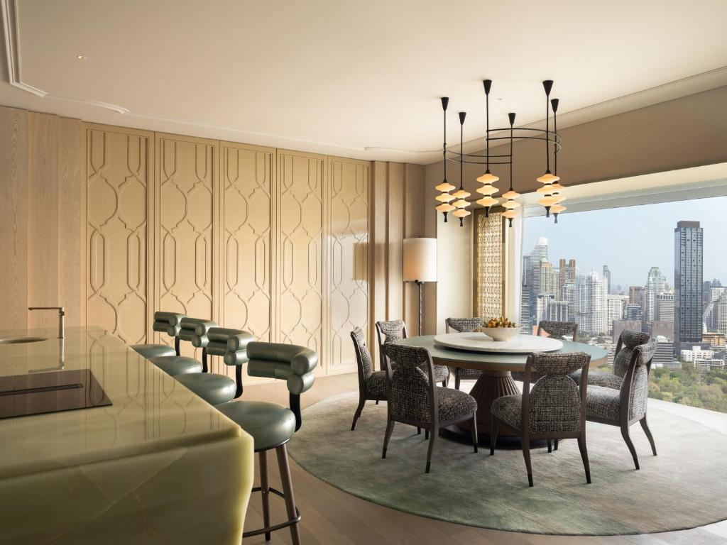 An elegant dining and lounge area with a wide city view.