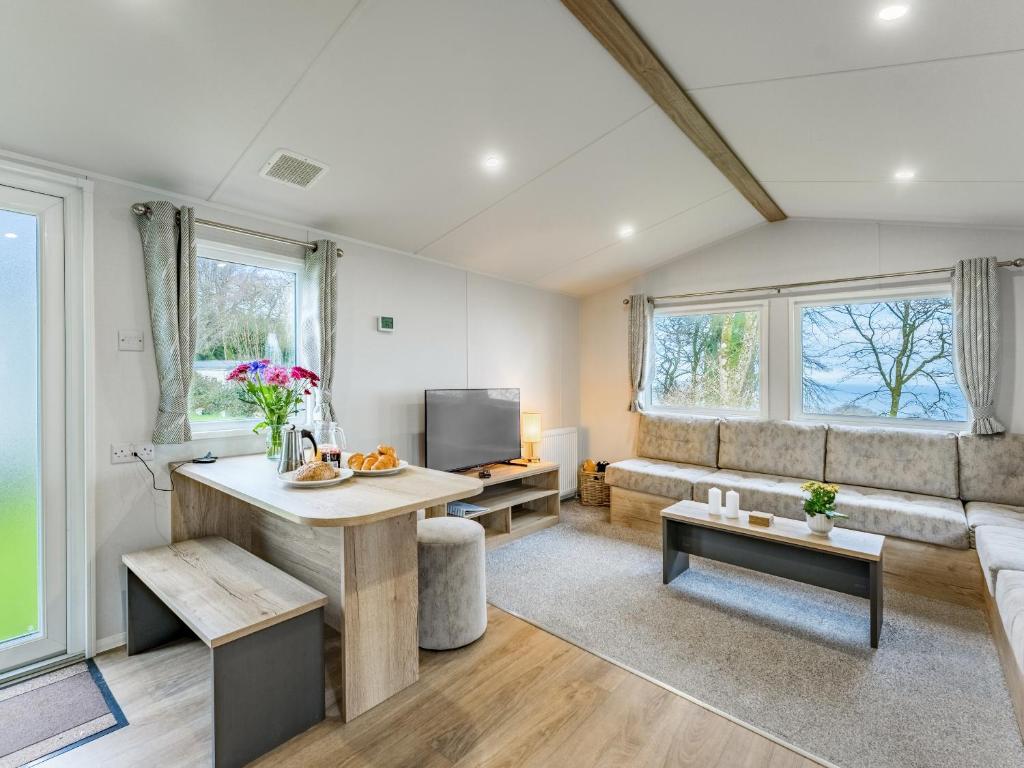 a living room with a couch and a table at No29 - Uk52060 in Hartland