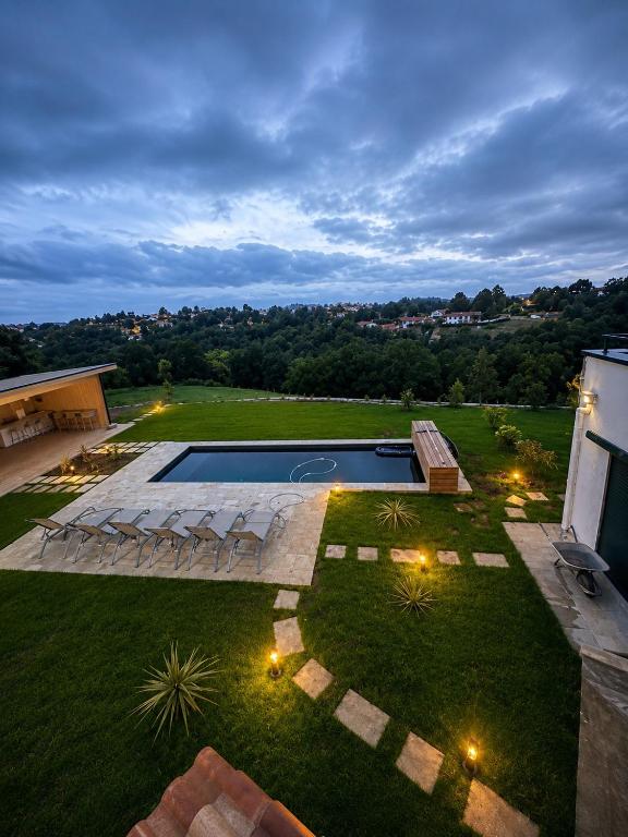 an aerial view of a backyard with a swimming pool at Villa ALDAKETA in Urrugne