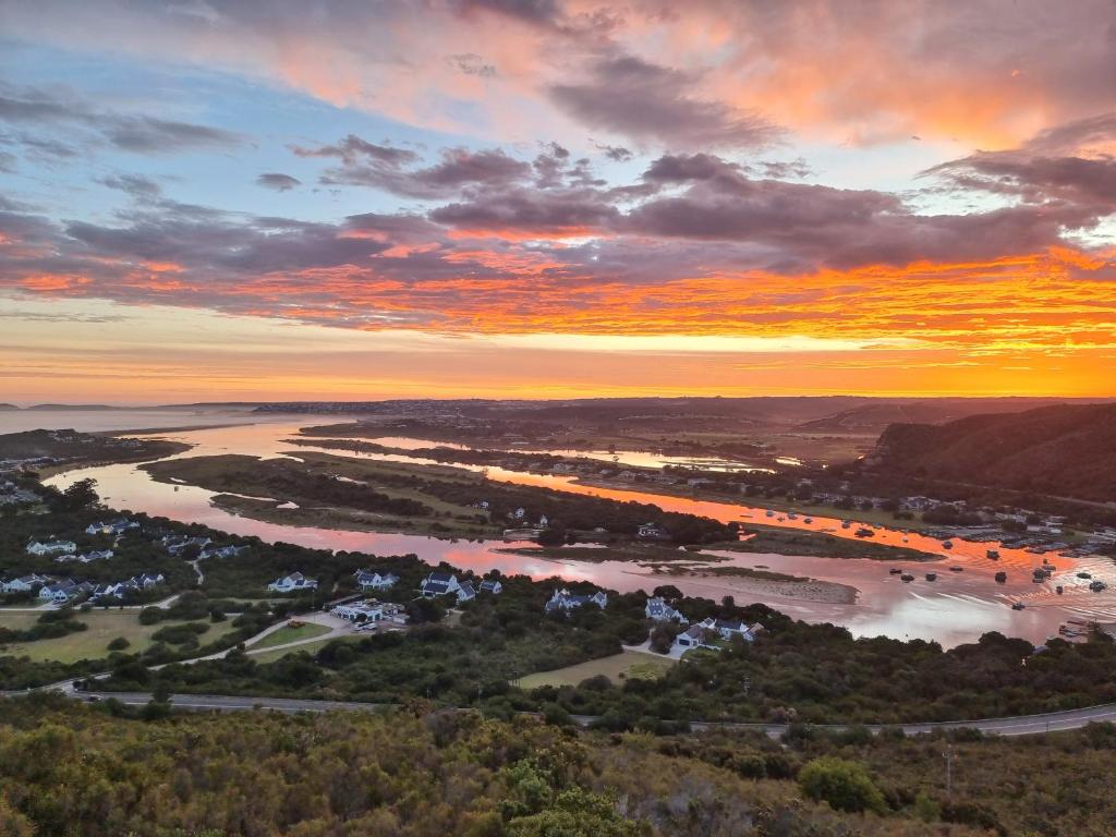 an aerial view of a river at sunset at Alkantmooi Private Nature Reserve - Keursee in Plettenberg Bay