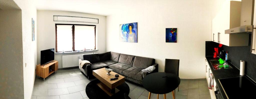 a living room with a couch and a table at Ferienwohnung Mosel in Piesport