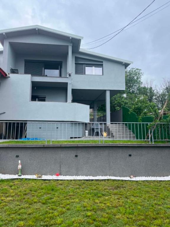 a house with a fire hydrant in front of it at Villa Utopia in Star Dojran