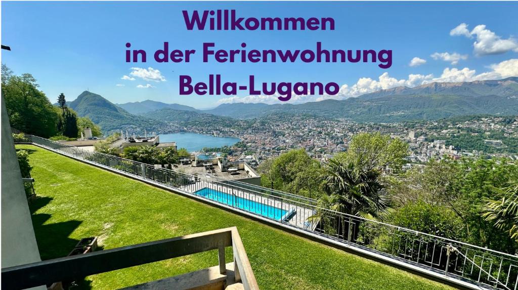 a view of a city from a hill with the words winnen in der fer at Bella-Lugano in Aldesago
