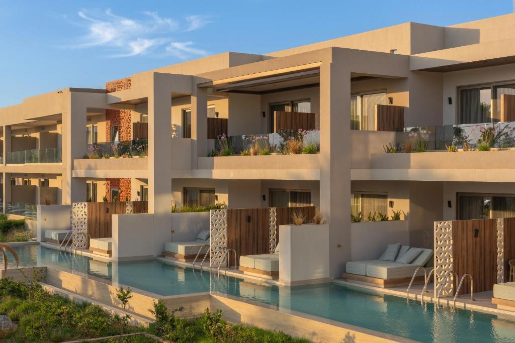 a rendering of a villa with a swimming pool at Marinos Beach Hotel in Platanes
