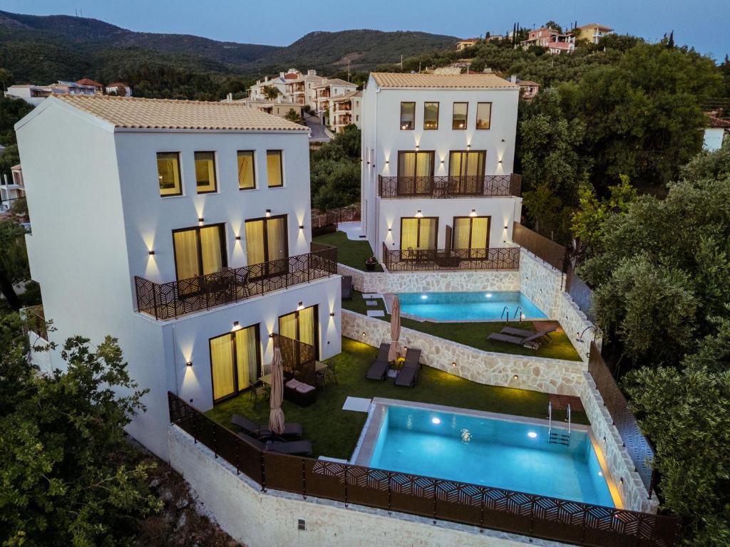 an aerial view of a house with a swimming pool at Malou and Charma Villas in Syvota