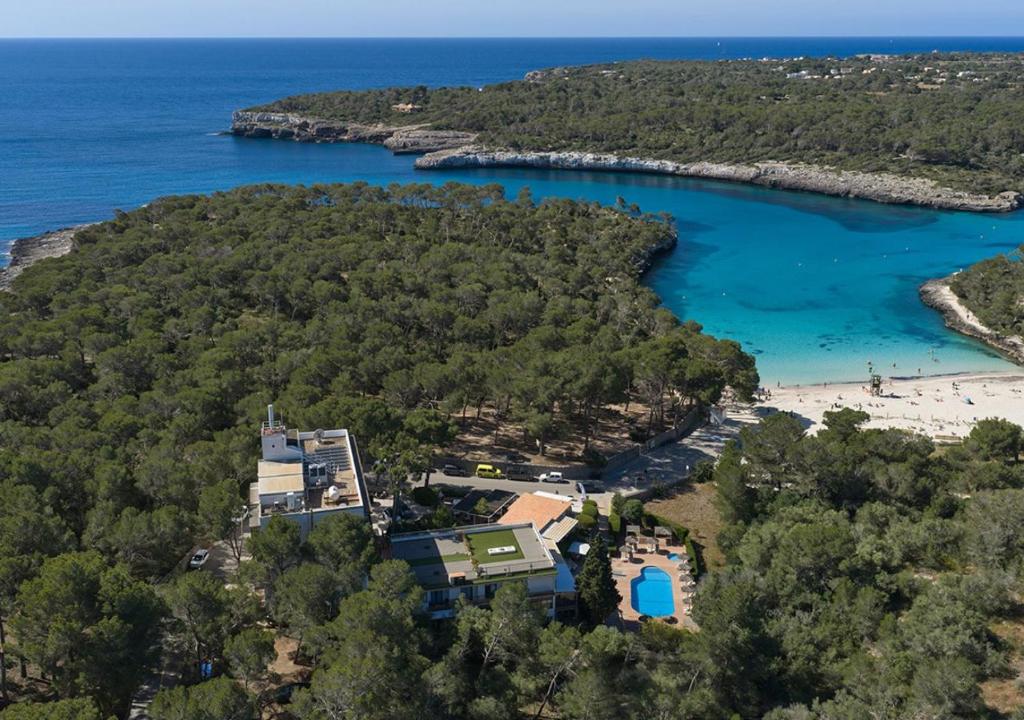 an aerial view of a resort and a beach at Hotel Playa Mondrago in Portopetro