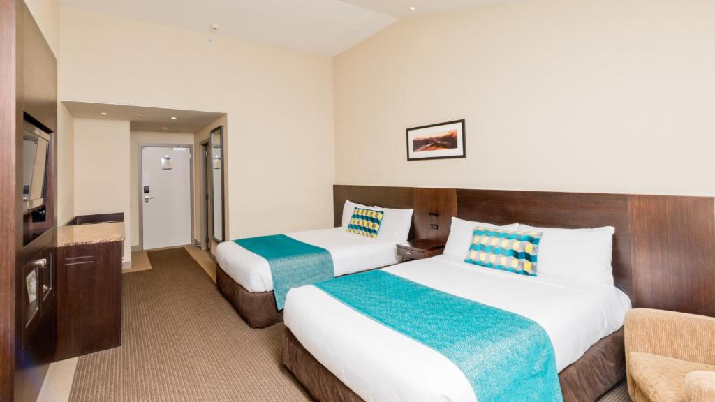 Postel nebo postele na pokoji v ubytování Copthorne Hotel & Resort Lakefront Queenstown