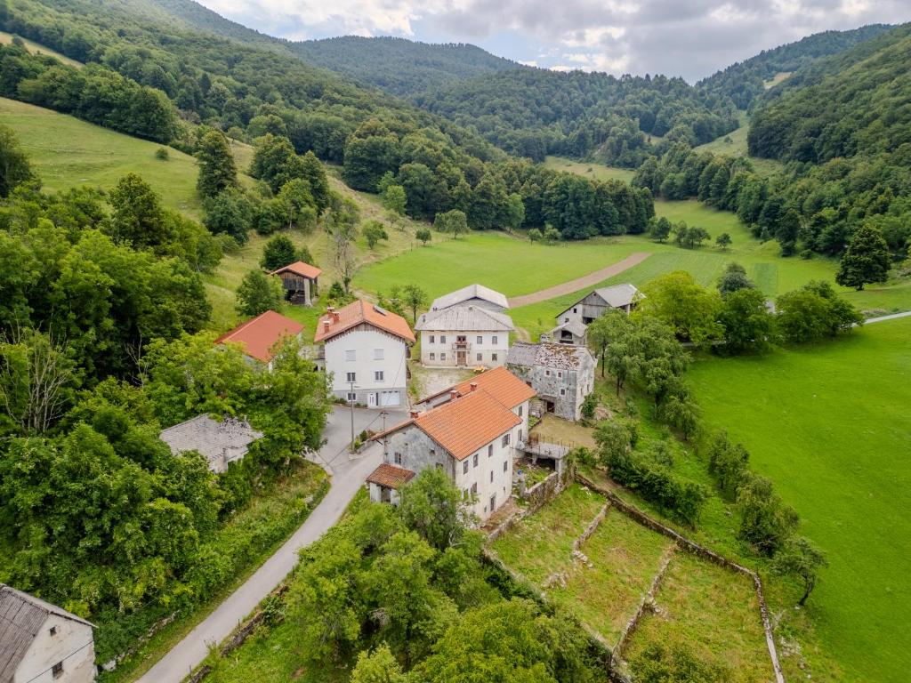 an aerial view of a castle in a green field at Holiday house Pod Ledinco in Most na Soči
