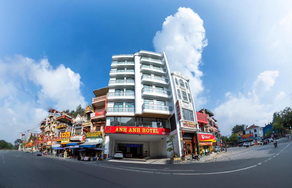 a white building on the side of a street at ANH ANH HOTEL in Bắc Hà