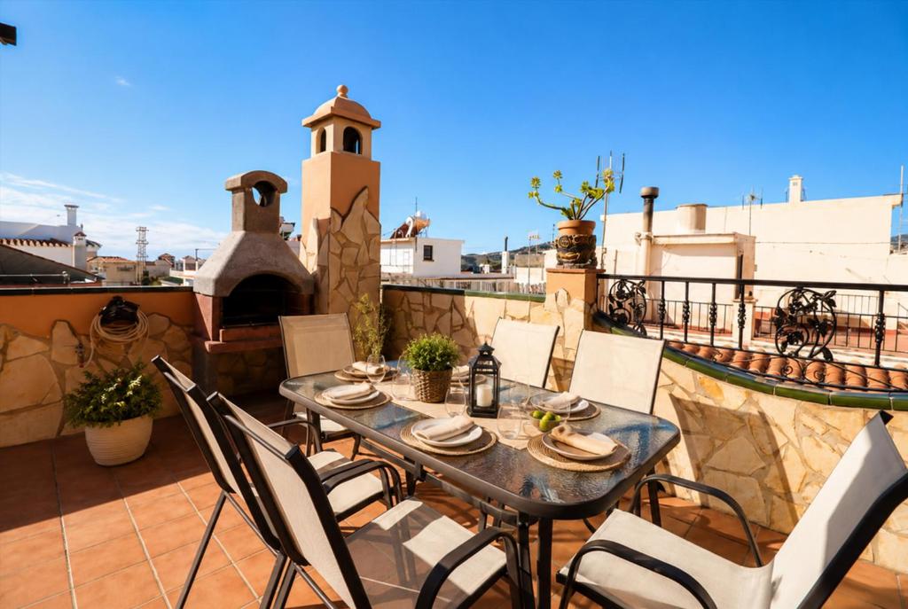 a patio with a table and chairs on a balcony at Casa Nayroa by Spainsunrentals 1019 in Nerja