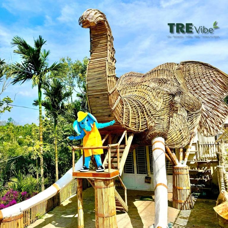 a statue of an elephant sitting in a chair at Tre Vibe Resort Daklak in Buôn Jung