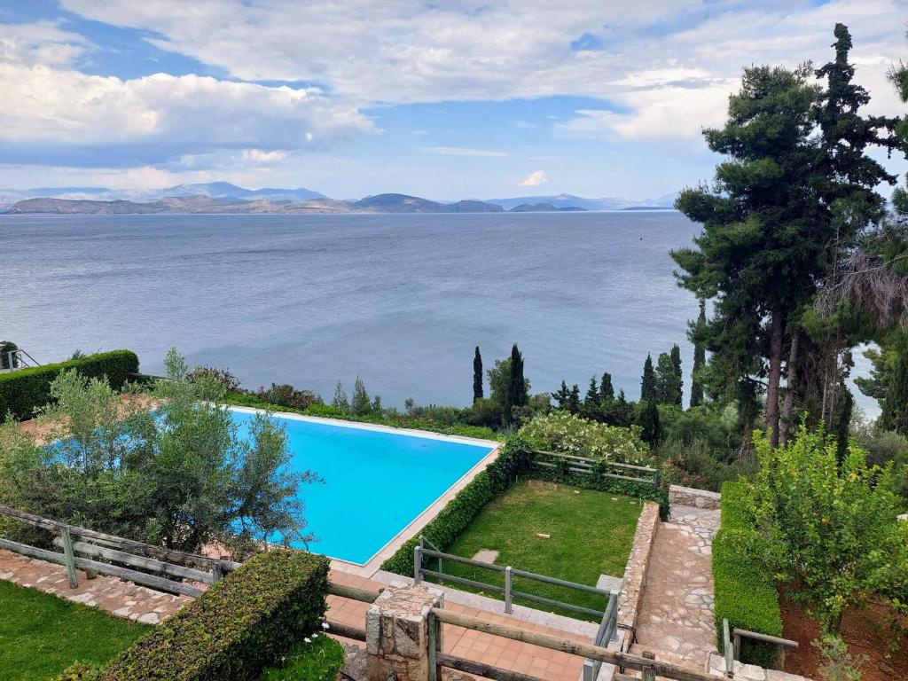 a swimming pool with a view of the water at Villa Lemóni - Villa by the sea with swimming pool and amazing view in Xiropigado
