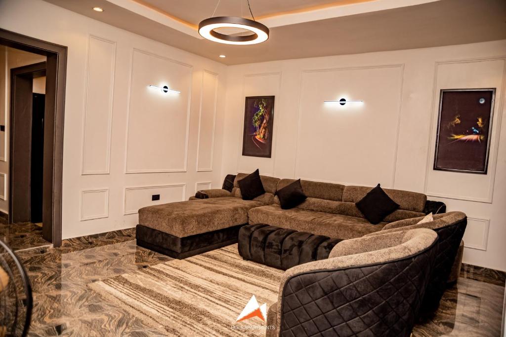 a living room with two couches and a couch at Hols in Kaduna