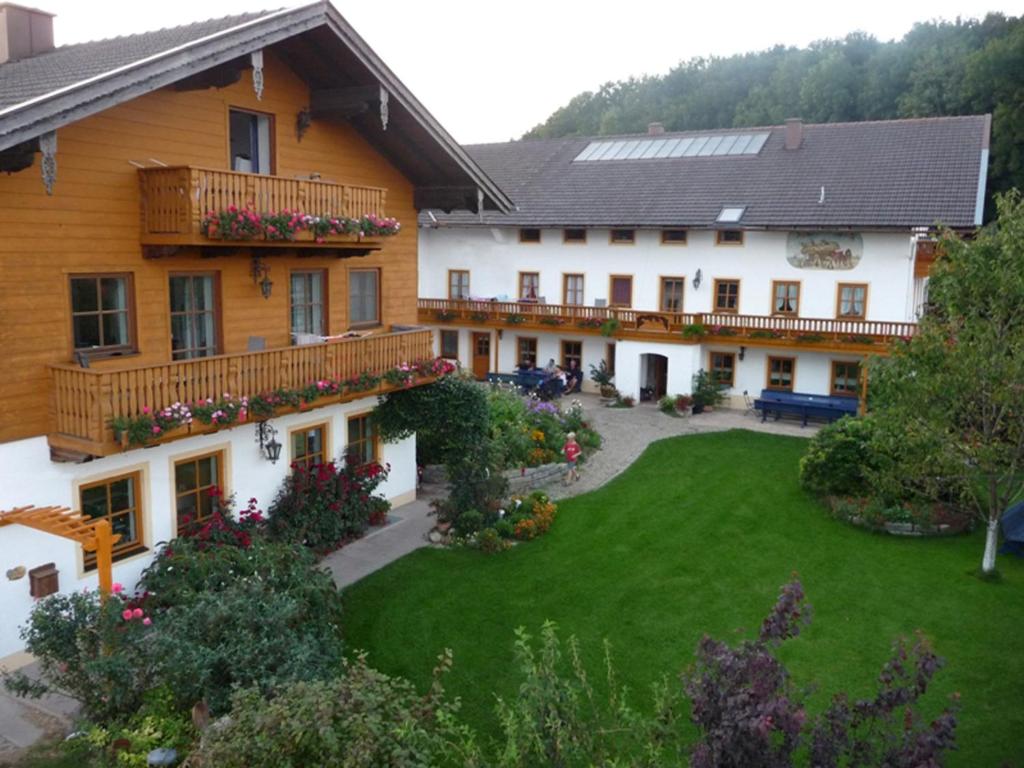 a large house with a yard in front of it at Mojer-Hof in Taching am See