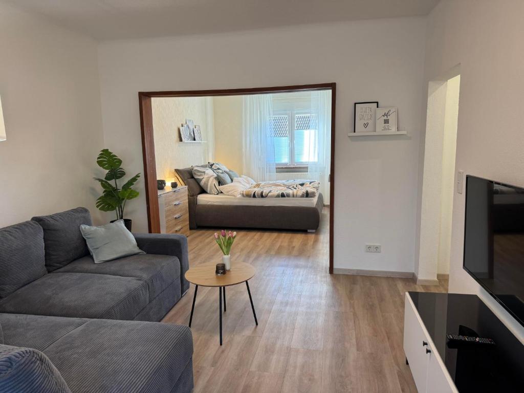 a living room with a couch and a table at Zur Sonnenseite in Oberthal