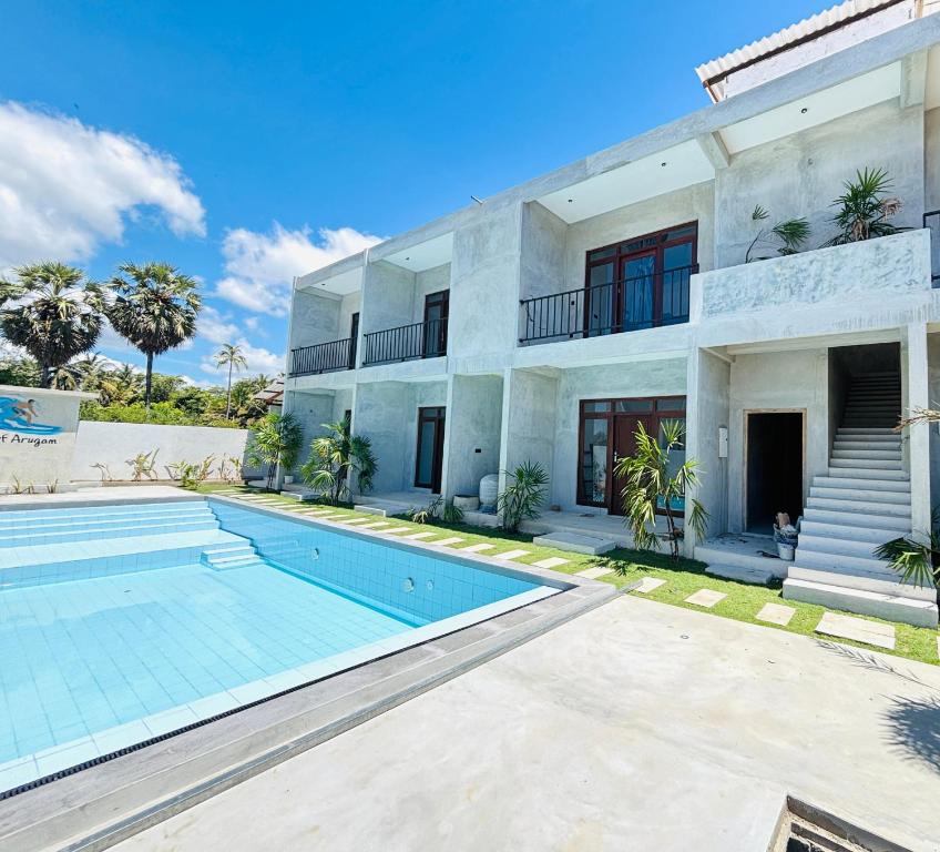an exterior view of a house with a swimming pool at Surf Arugam in Arugam Bay
