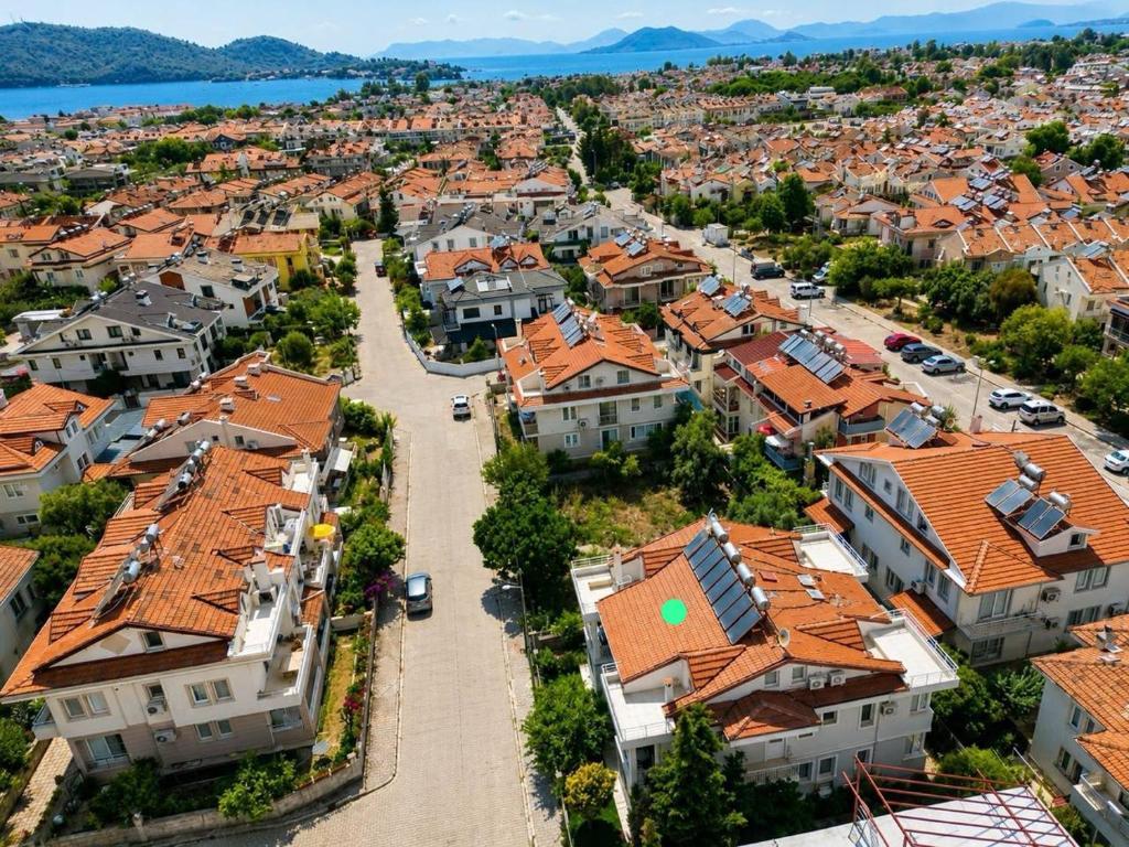 an aerial view of a town with orange roofs at Fethiye Merkezde Lüx Daire in Fethiye