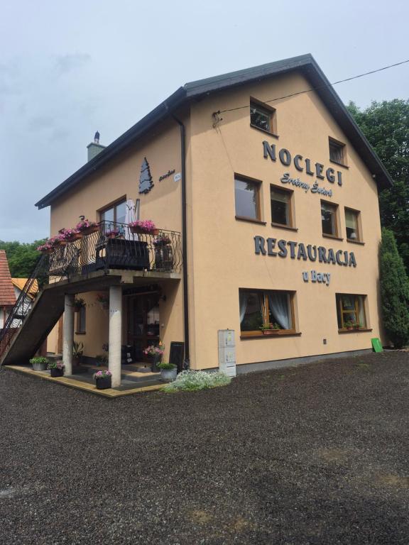 a building with a balcony on the side of it at Srebrny Świerk in Wambierzyce