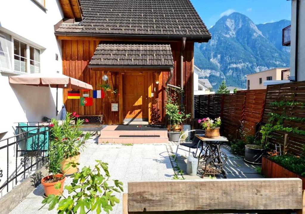 a house with a patio with mountains in the background at Chalet Ferreira in Weite