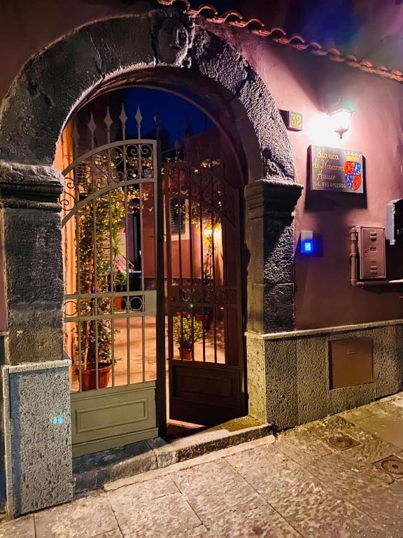 an entrance to a building with an open door at Bianca di Navarra House in Biancavilla