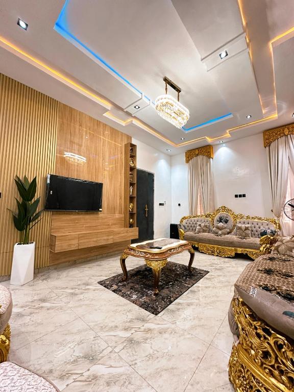 a living room with a couch and a table at The Movia Residences 1 in Enugu