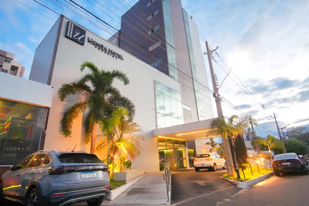 a car parked in front of a building at Uchôa Teresina Hotel in Teresina