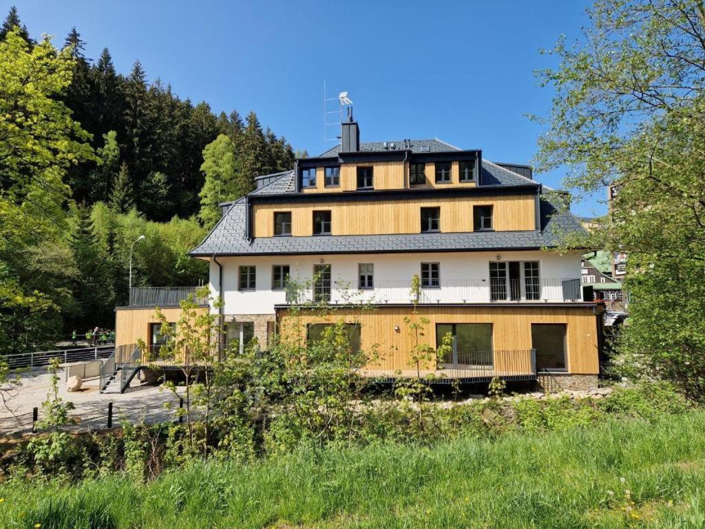 a large house sitting on top of a hill at PEC 140 - apartmány Máj in Pec pod Sněžkou