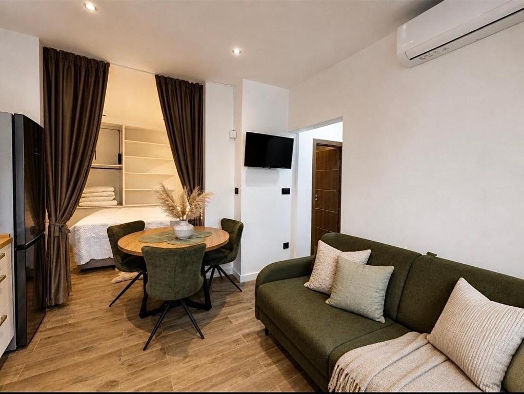 a living room with a couch and a table at Apartment Lidija in Split
