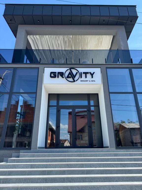 a sign on the front of a city building at Gravity Resort & Spa in Solotvyno