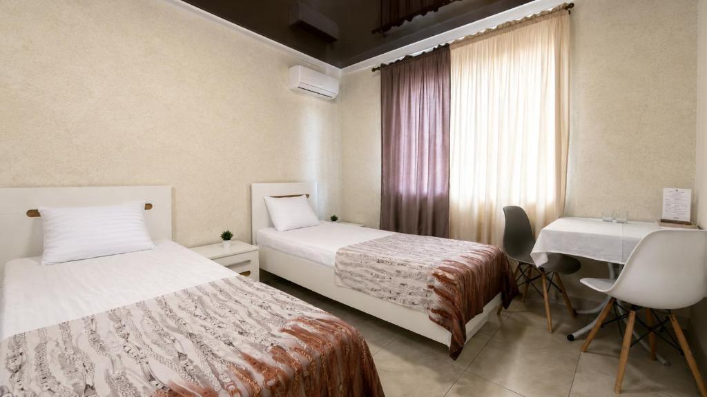 Ліжко або ліжка в номері Bloom Hotel