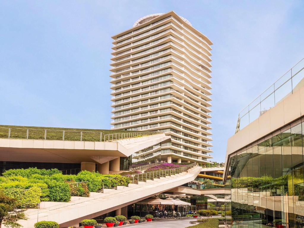 a tall building with a staircase in front of it at Raffles Istanbul in Istanbul